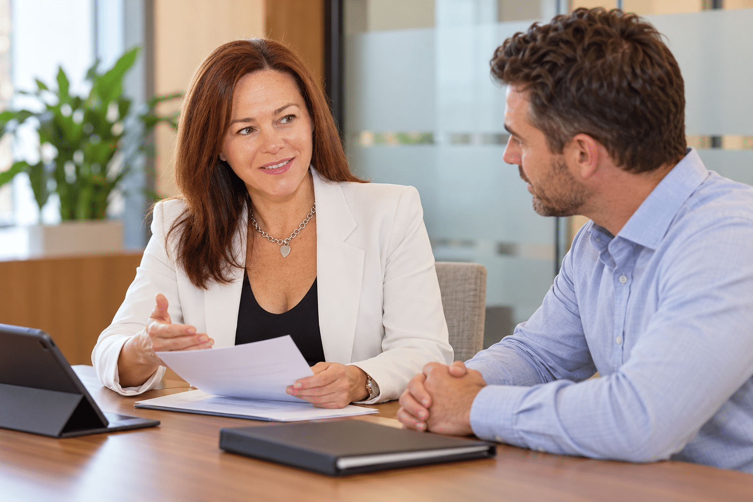 Julie Ring discussing a claim and return-to-work plan with an employer